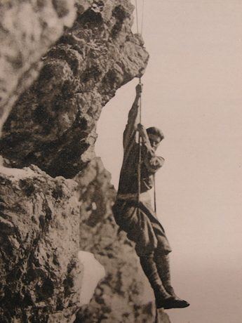 Pier Giorgio Frassati climbing a rock face