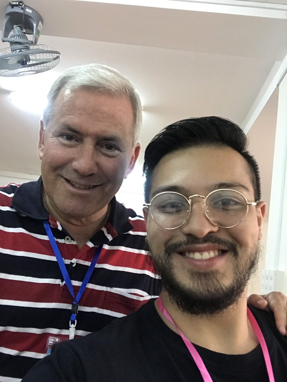 Selfie of Benz Rodil with a smiling chapter participant in a striped polo shirt